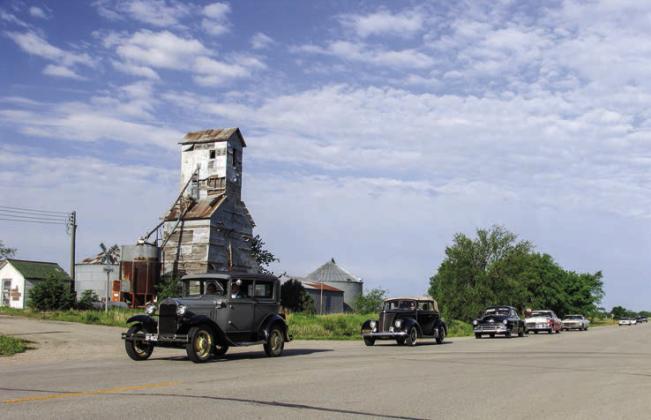Vintage vehicles pass through the unincorporated town of Rice east of Concordia during the first Kansas White Way car run in 2006. This year’s car run celebrates the 100th anniversary of the inaugural car run in 1914.