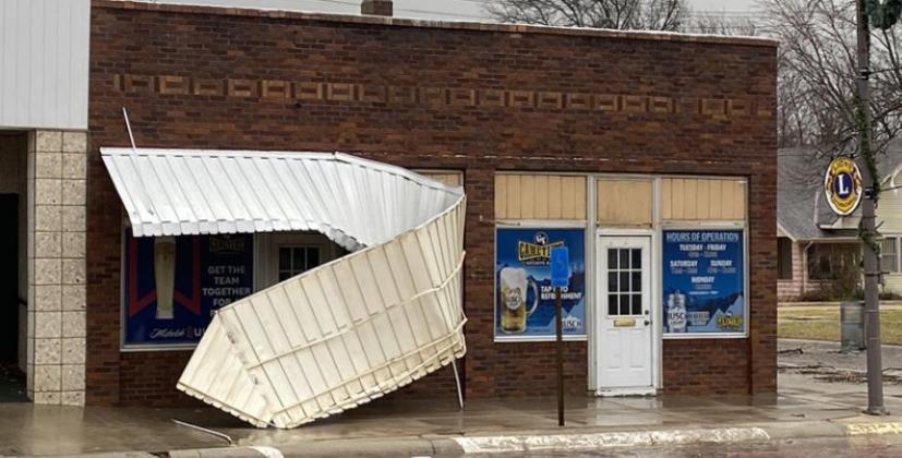 Power outages and tree and property damage were the result of high winds that came through the county on Wednesday afternoon. Above Game Time Sports Bar lost their canopy, below, part of a large tree fell at the Kurtis and Ashley Voelker residence in Palmer, and right, Michael and Tonya Weiche lost a shed south of Barnes.